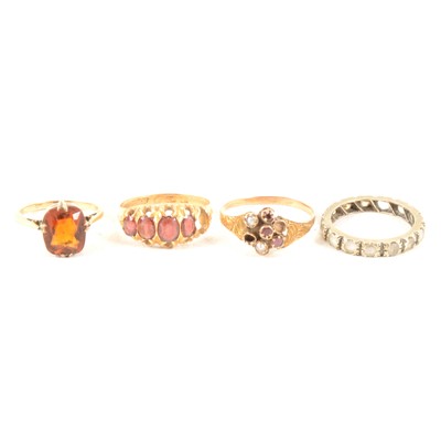 Lot 355 - Four vintage dress rings - in worn condition, some missing stones.