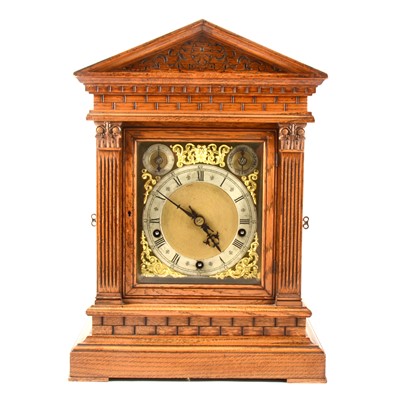 Lot 235 - A late Victorian oak mantel clock