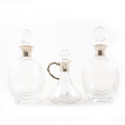 Lot 324 - A pair of French Vannes crystal decanters, with stoppers, silver collars, 24cm; cut-glass ship's decanter.