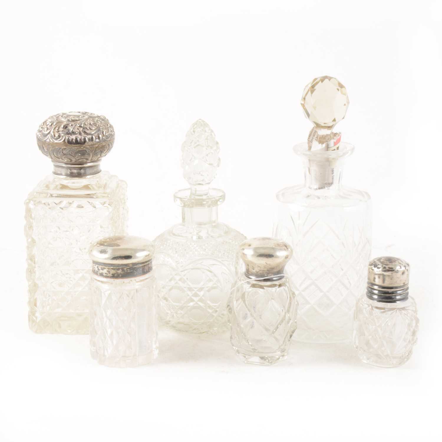 Lot 110 - Four silver capped scent bottles and two glass scent bottles.