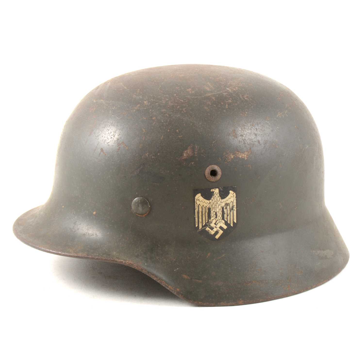 Lot 113 - WWII German steel war helmet with side decals.