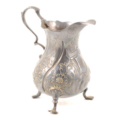 Lot 135 - 18th Century Silver cream jug, embossed decoration. G.S. London 1763.