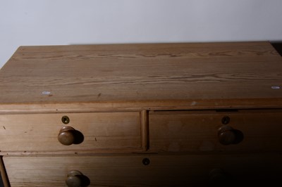Lot 24 - A stripped pine chest of drawers