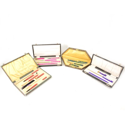 Lot 186 - Four brightly coloured Art Deco writing sets.
