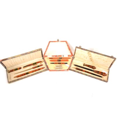 Lot 187 - Three Art Deco amber coloured Bakelite writing sets.