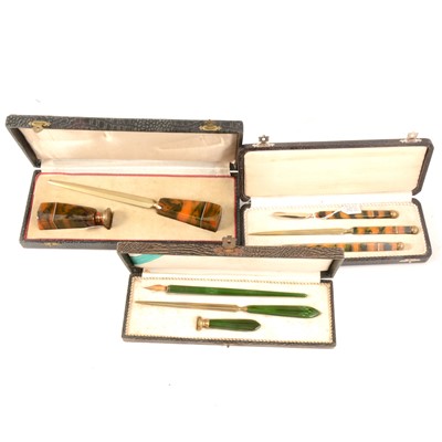 Lot 183 - Three Art Deco Bakelite and gilt metal writing sets.