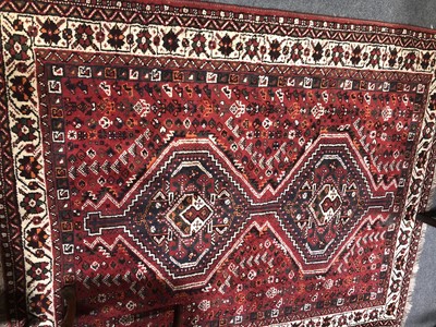 Lot 645 - A Shiraz rug, two joined lozenge motifs on a...