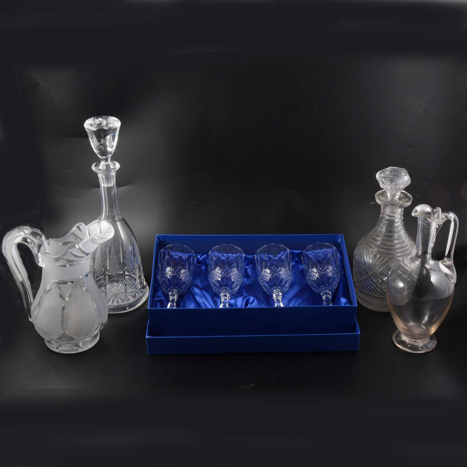 Lot 59 - A quantity of cut crystal glass decanters, jugs, and stemware.