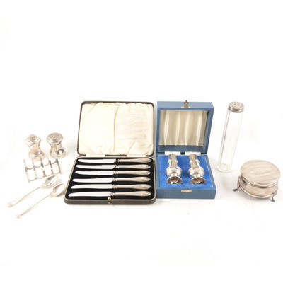 Lot 321 - A collection of small silver items, including salt and pepper set, toast rack, flatware etc.