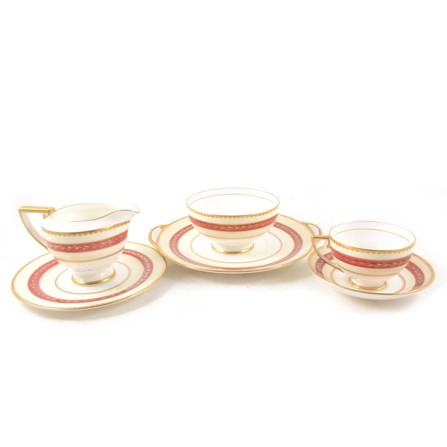 Lot 20 - Royal Doulton bone china teaset, cream and red banded, with gilt.