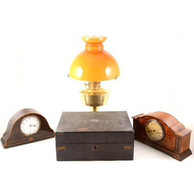 Lot 290 - An Edwardian mantel clock, a walnut cased mantel clock, brass oil lamp, and writing box