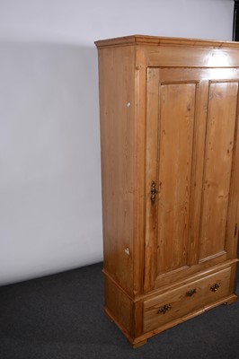Lot 139 - A stripped pine armoire