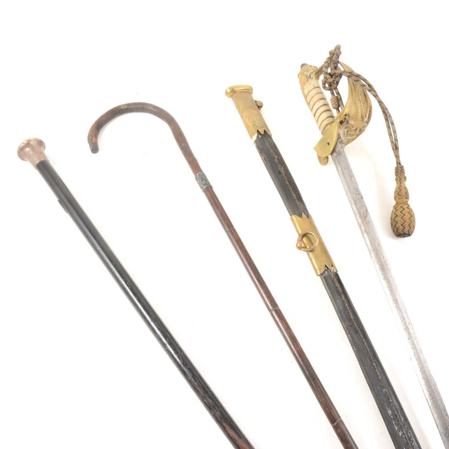 Lot 213 - A Royal Naval officer's sword, a walking stick, and a silver-capped cane