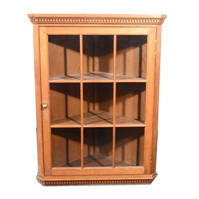 Lot 535 - An oak corner hanging display cabinet