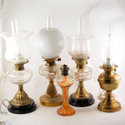 Lot 157 - A brass oil lamp and four others