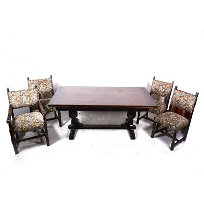 Lot 527 - A reproduction stained oak dining room table and six chairs