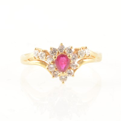 Lot 354 - A ruby and diamond cluster ring.