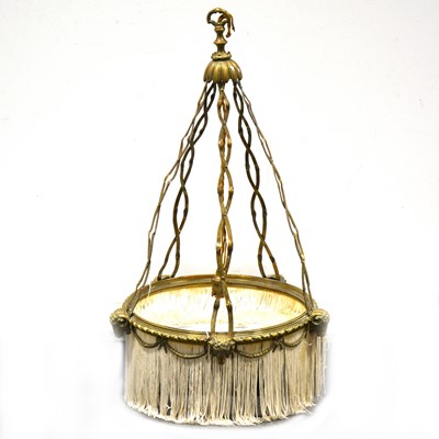 Lot 560 - A cast brass ceiling light, cast with Rams heads