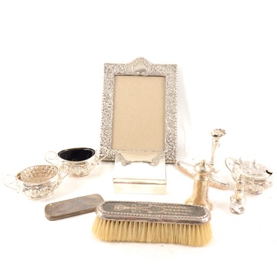 Lot 327 - A selection of silver items, to include silver condiments, photograph frame, cigarette box, etc.