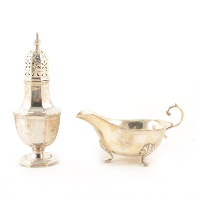 Lot 330 - A silver caster and silver sauce boat.