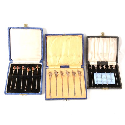 Lot 88 - Three cased sets of silver cocktail sticks.
