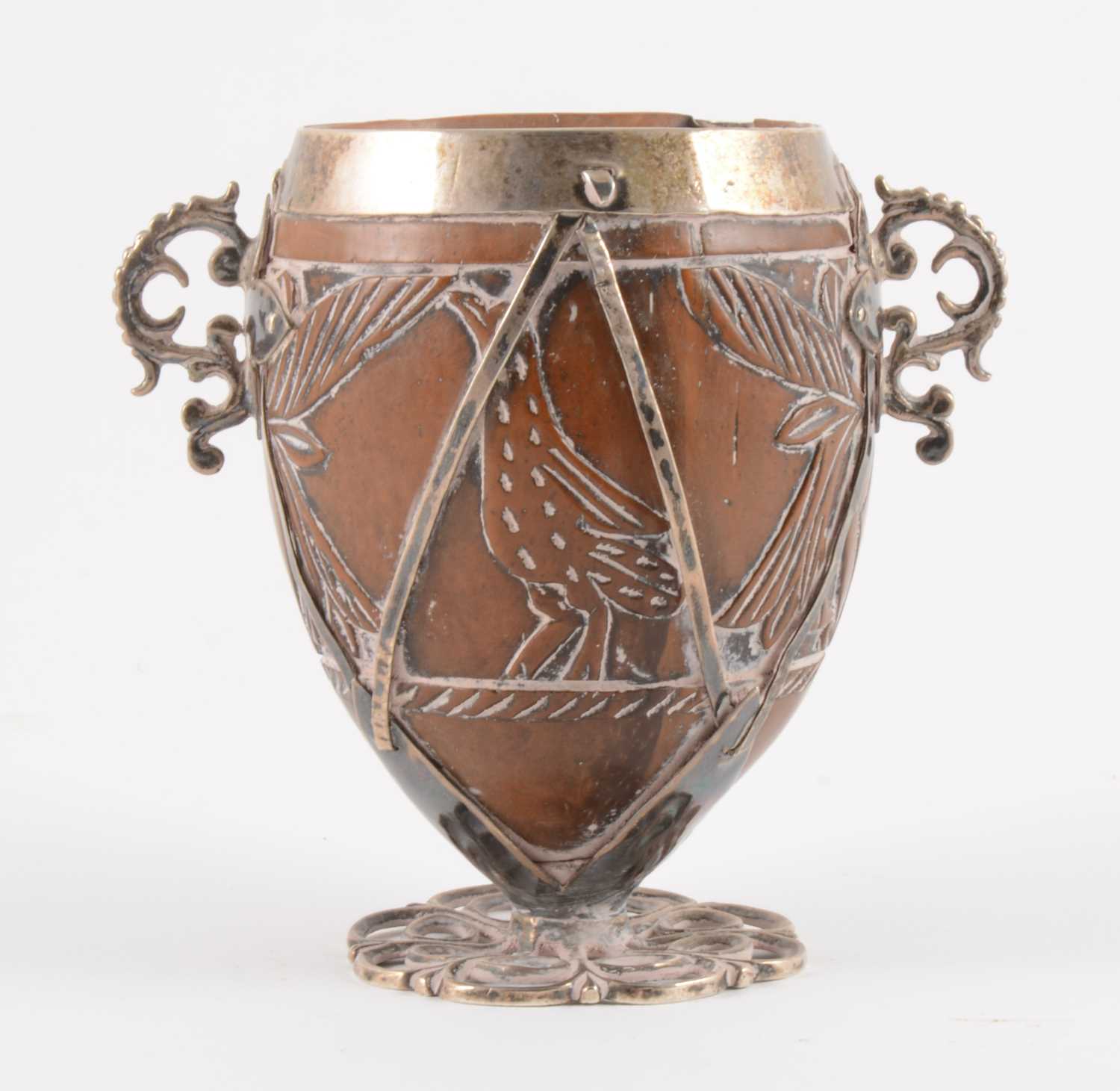 Lot 90 - A white metal mounted coconut cup of ovoid form, pricked date 1590