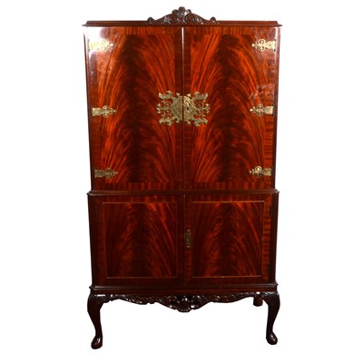 Lot 495 - A reproduction mahogany finish cocktail cabinet