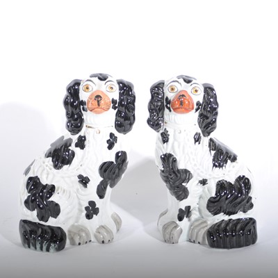 Lot 49 - A pair of Victorian Staffordshire pottery King Charles Spaniels, 28cm.