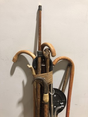 Lot 635 - Collection of walking sticks, shooting stick, etc.