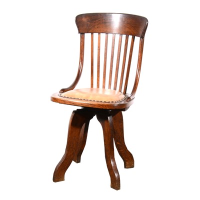 Lot 80 - An oak swivel office chair