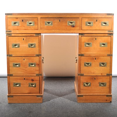 Lot 545 - A pine campaign type twin pedestal desk