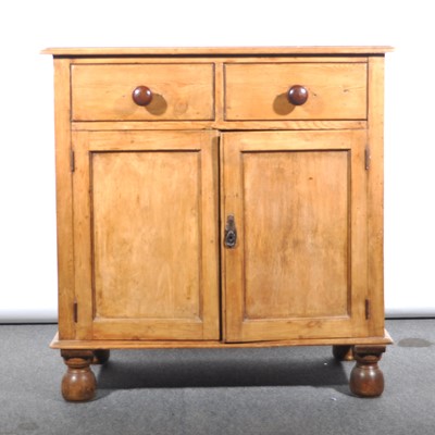 Lot 552 - A stripped pine cabinet