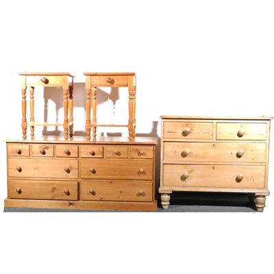 Lot 577 - A modern pine long chest of drawers, pine chest of drawers and two beside tables.