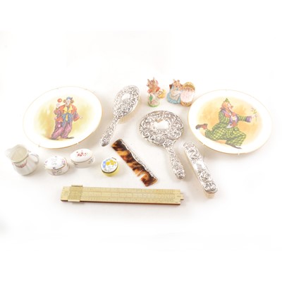 Lot 120 - A slide rule, metal rule, silver four piece dressing table set, two Beatrix Potter figures