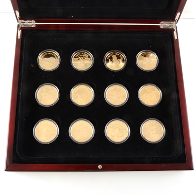 Lot 408 - The Golden History of Powered Flight - a set of 12 silver gilt commemorative coins in fitted case.