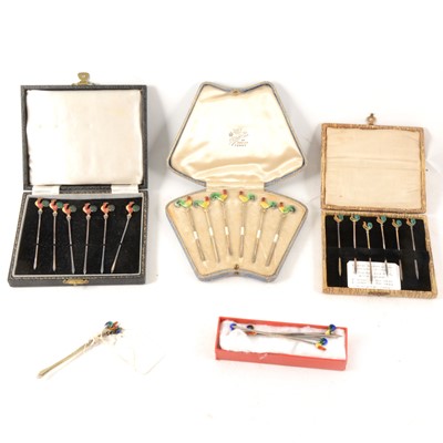 Lot 87 - Four sets of silver and enamel "cockerel" cocktail sticks.