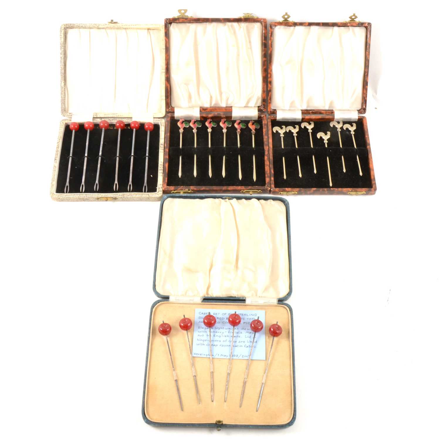Lot 91 - Six sets of white metal and silver-plated cocktail sticks.