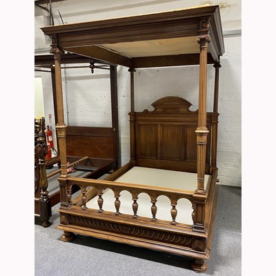 Lot 323 - A French walnut four-poster bed