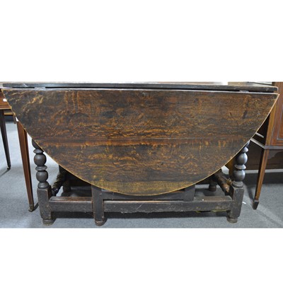 Lot 509 - An old oak gateleg table