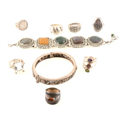 Lot 327 - A collection of modern silver and white metal bangles, bracelets and rings.