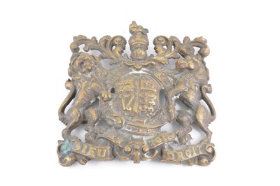 Lot 175 - A cast brass plaque, designed as The Royal Arms