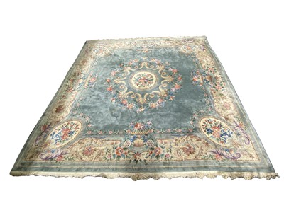 Lot 329 - A large Chinese carpet