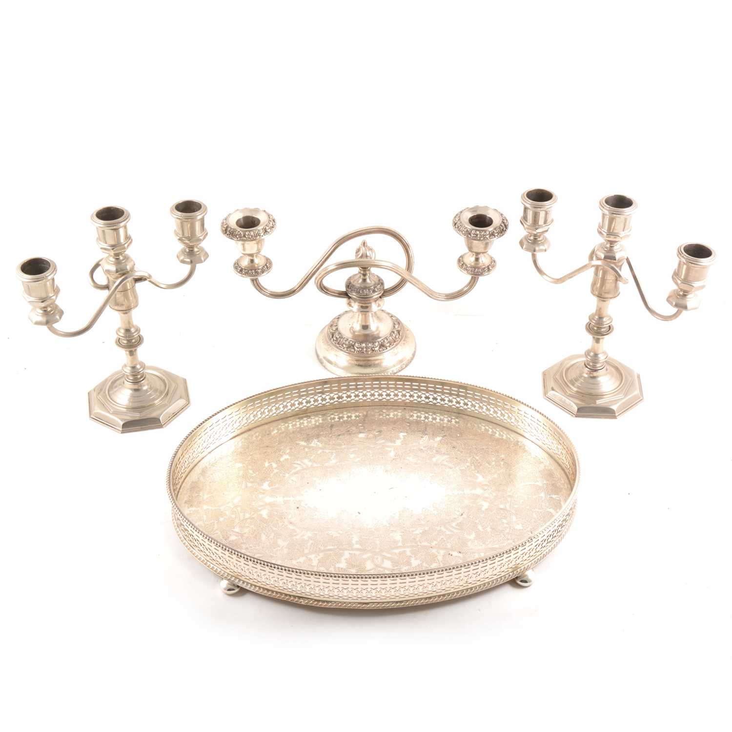 Lot 100 - A pair of plated three-light candelabra, a tray and a two-light candelabra