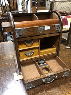 Lot 558 - An Edwardian oak smoker's cabinet