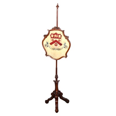 Lot 541 - A Victorian mahogany pole screen, inset with tapestry crest for Trinity College, Cambridge