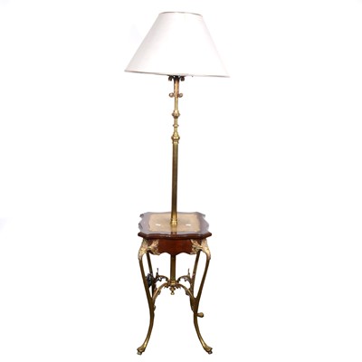 Lot 582 - An Edwardian brass patent lamp table,...