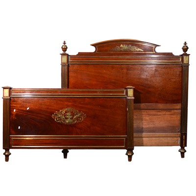 Lot 588 - A French walnut and brass inlaid Empire style double bedstead