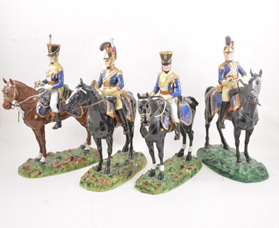 Lot 94A - A set of four Dresden porcelain military equestrian models