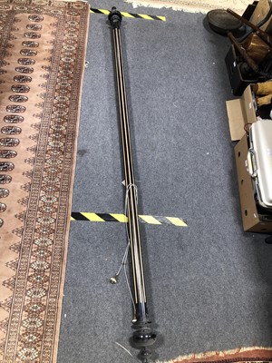 Lot 647 - Regency style curtain rail, ebonised and gilt with carved caps