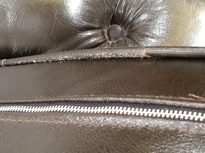 Lot 411 - A modern two-seater leather settee in the Chesterfield style
